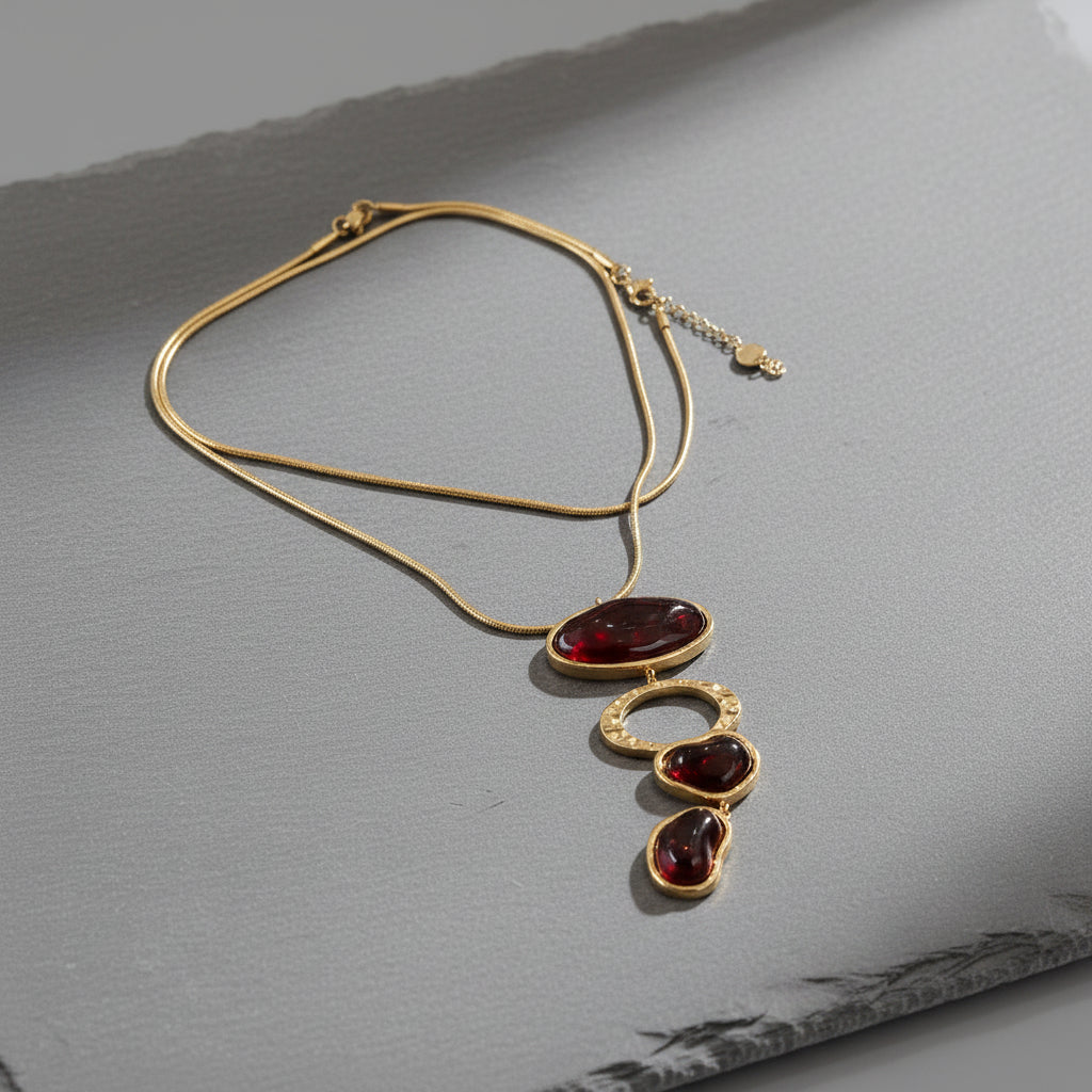 COLLANA DORATA CON PIETRE ROSSO BRUNO